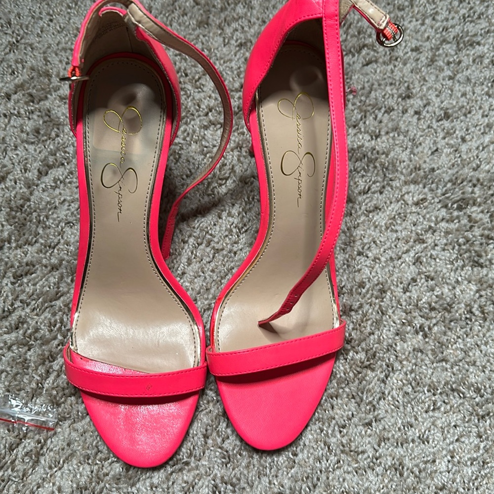 Neon pink Jessica Simpson heels gently worn